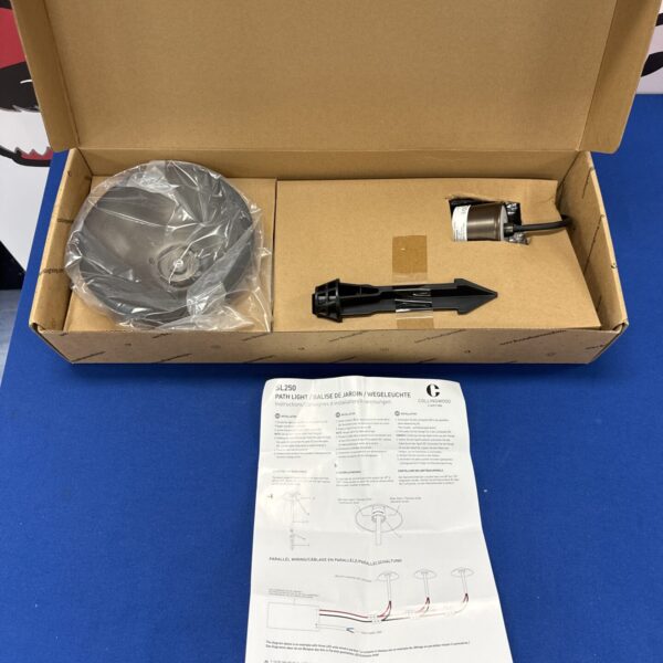 Unopened box of a Collingwood SL250 pathway light for garden illumination.