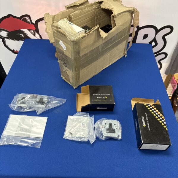 Assorted electrical plug sockets in a cardboard box.