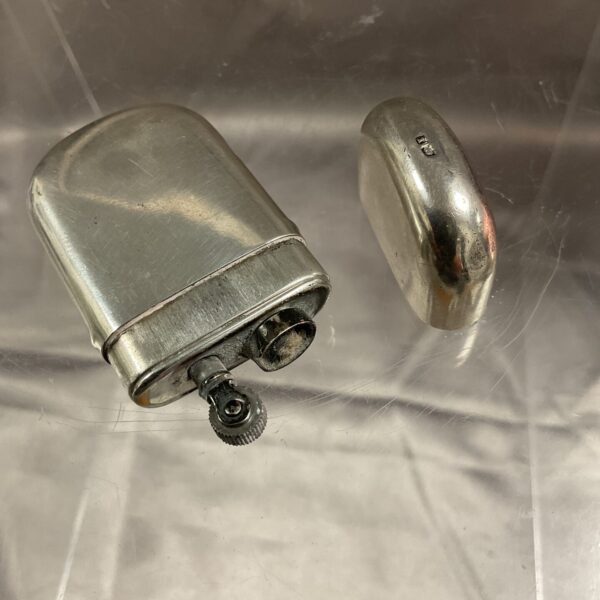 Hallmarked silver cigarette lighter, vintage collectible smoking accessory.