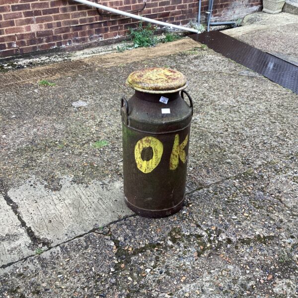 Vintage metal milk churn, a collectible dairy farm item.