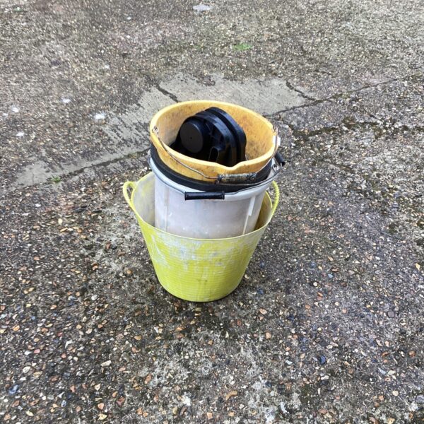 Yellow plastic buckets for garden and household use.