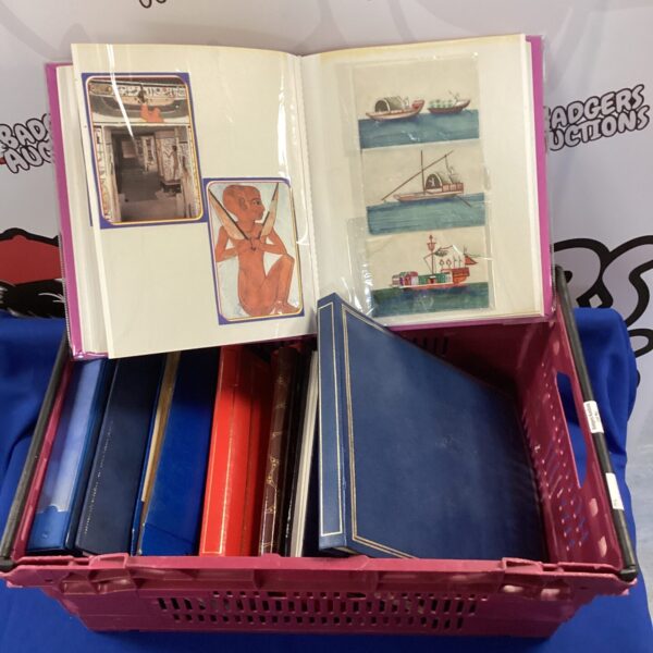 Crate full of postcards albums with postcards from across the world