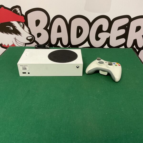 Xbox Series S console with Xbox 360 remote for gaming.