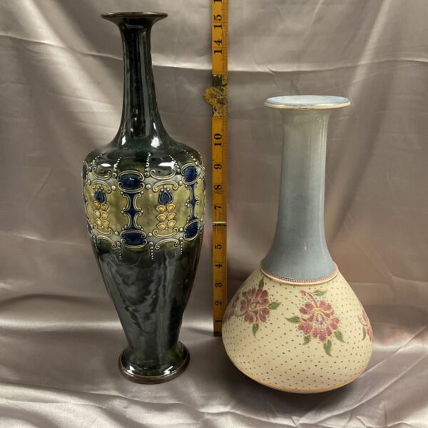 Royal Doulton stoneware vase with green glaze and floral decoration.