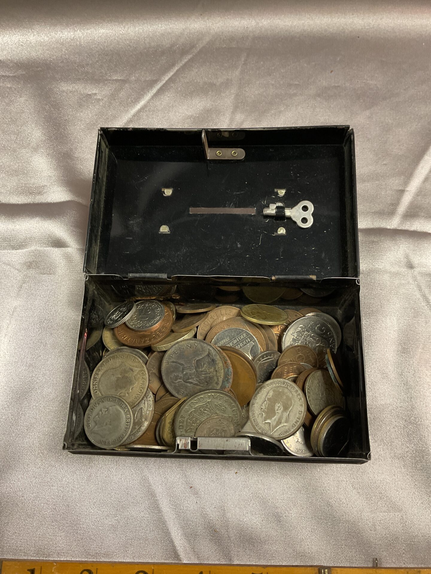 792 Vintage money box tin with assorted coins
