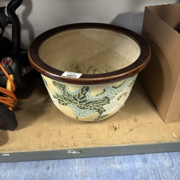 Vintage salt glazed plant pot with detailed foliage design.