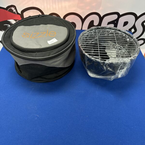Sizzle portable barbecue in its carrying case, ready for outdoor cooking.