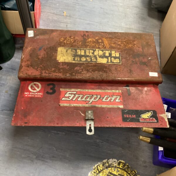 Front view of a vintage Snap-on toolbox with weathered paint.