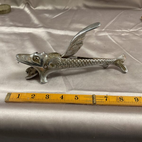 Side view of vintage fish nut cracker, 1930s kitchenalia.