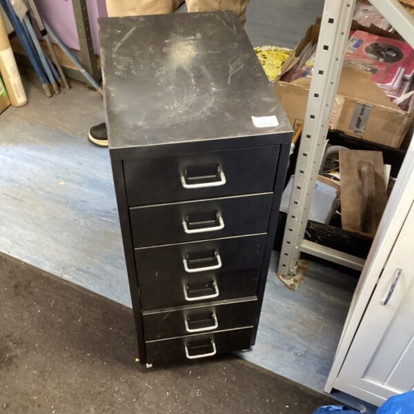Vintage metal filing cabinet with multiple drawers for office storage.