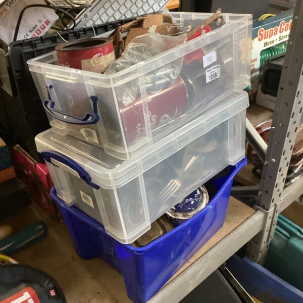 Clear plastic boxes filled with mixed metal and nails.