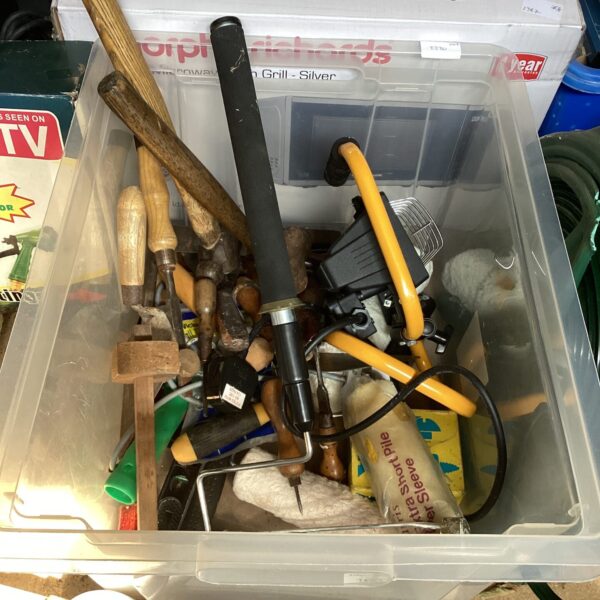 Mixed tool lot with a portable site light for DIY projects.