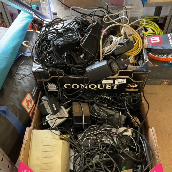 Mixed lot of cables and chargers for electronic devices.