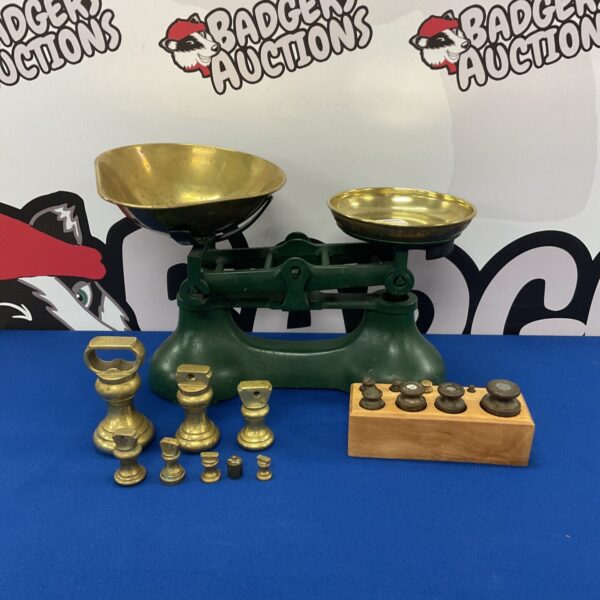 Antique cast iron scales with brass pan and weights.
