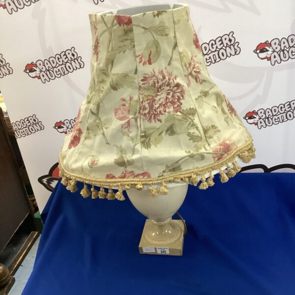 Vintage table lamp with floral shade for home decor.