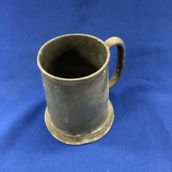 Antique pewter tankard with loop handle, vintage collectible pubware.