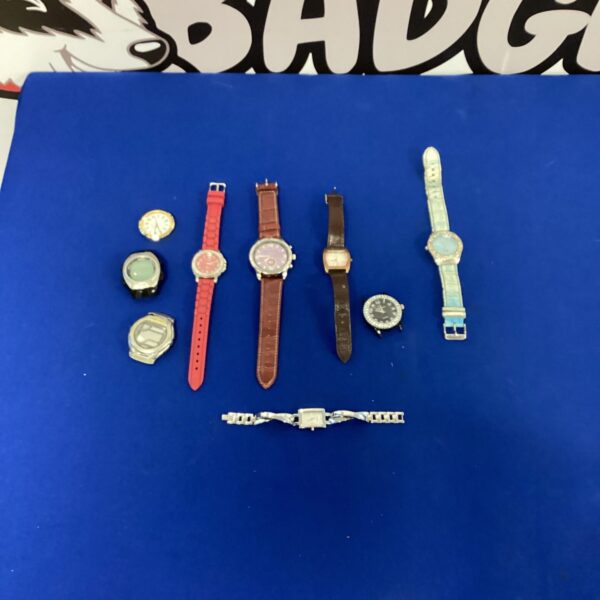 Vintage wrist watch lot with various styles and designs.