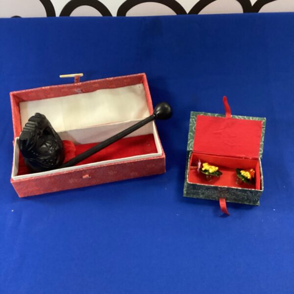 Traditional Chinese wooden frog percussion instrument with stick.