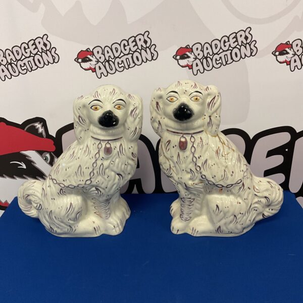 Antique Victorian Staffordshire spaniels, a collectible porcelain pair.