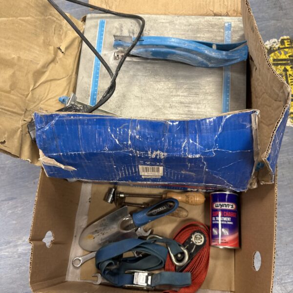 Mixed tool lot featuring a Ferm electric tile cutter and various hand tools.