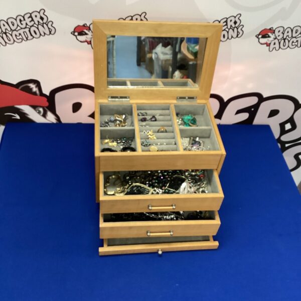 Vintage wooden jewellery box filled with fashion jewellery and accessories.