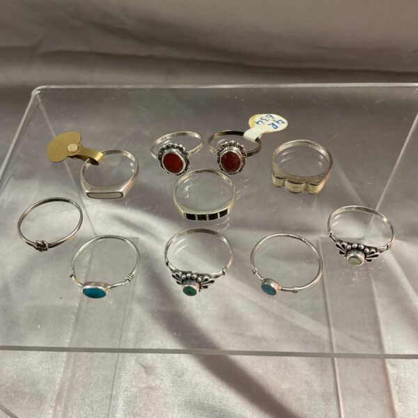 Assorted 925 silver rings displayed for sale.