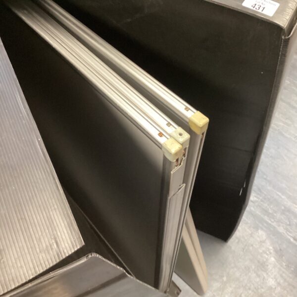 Dark surface folding notice board for display and pinning.