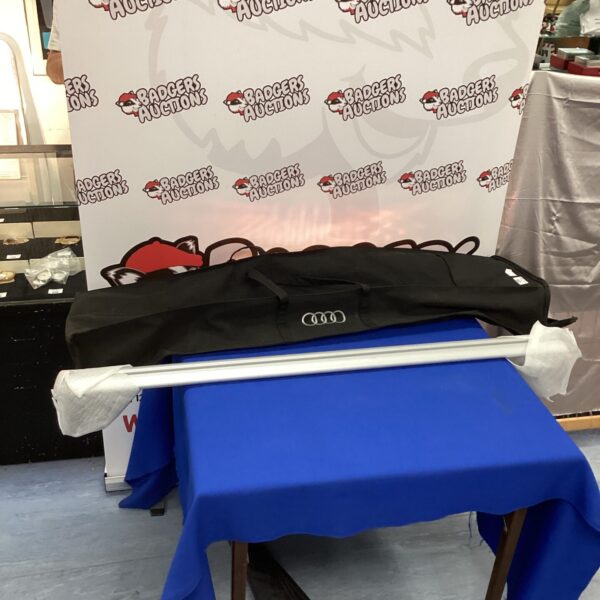 Audi roof bars with carry case for vehicle storage.