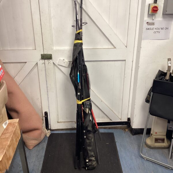Bundle of used fishing rods and a landing net.