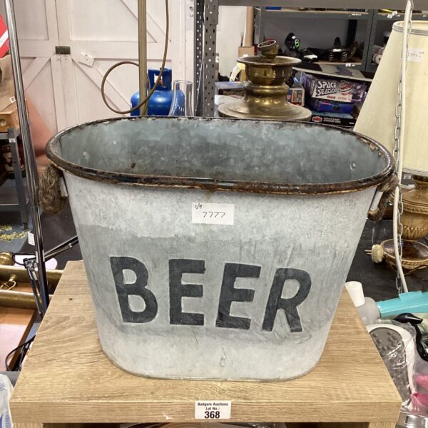 Vintage metal beer bucket displaying the word "BEER".