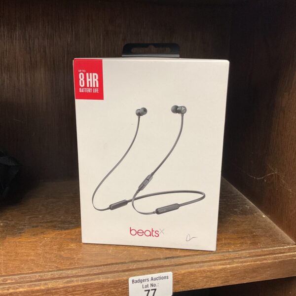 Wireless Beats X headphones in black, ideal for music lovers.