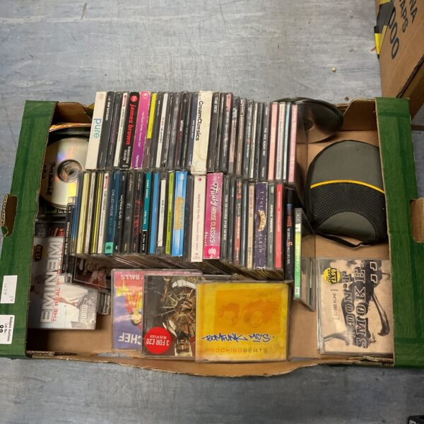Tray of assorted music CDs including Eminem and Bomfunk MCs.