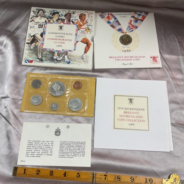 Front view of the 1986 Commonwealth Games £2 coin collection with Canadian coins.
