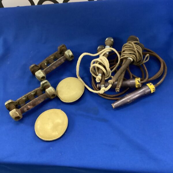 Vintage skipping ropes and hand grips, retro fitness equipment.