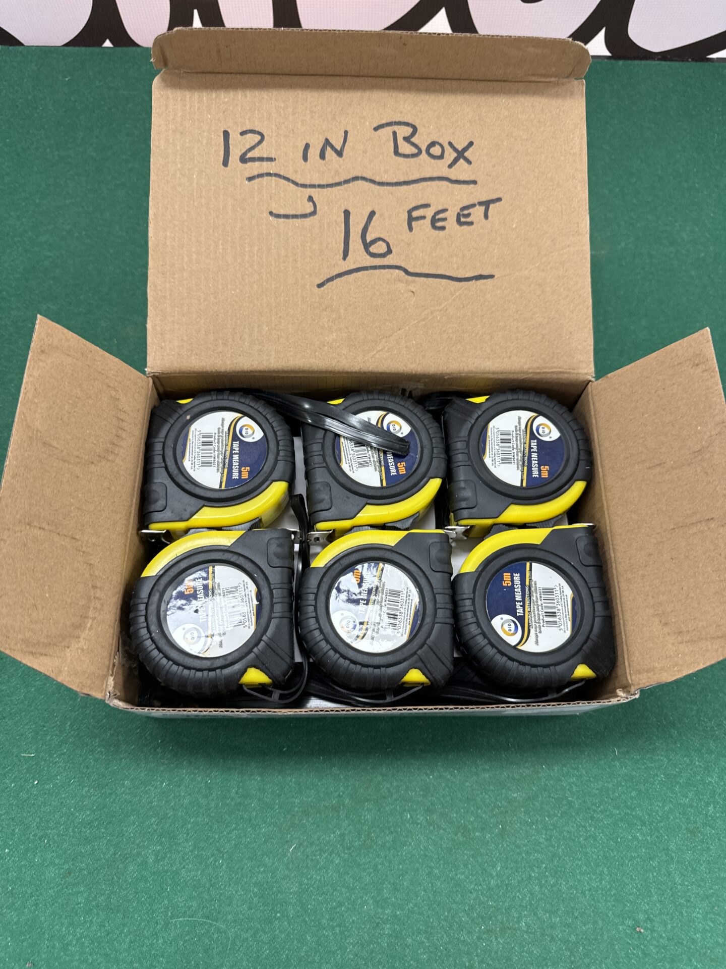 1026 Twelve new 16ft tape measures