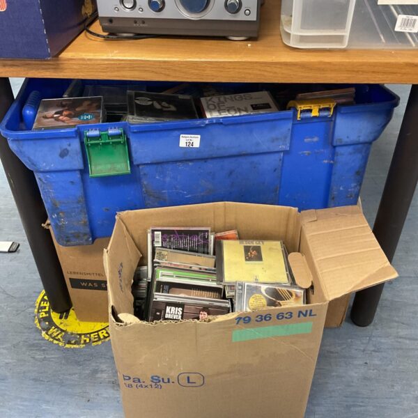Stack of three boxes filled with a music CD collection.