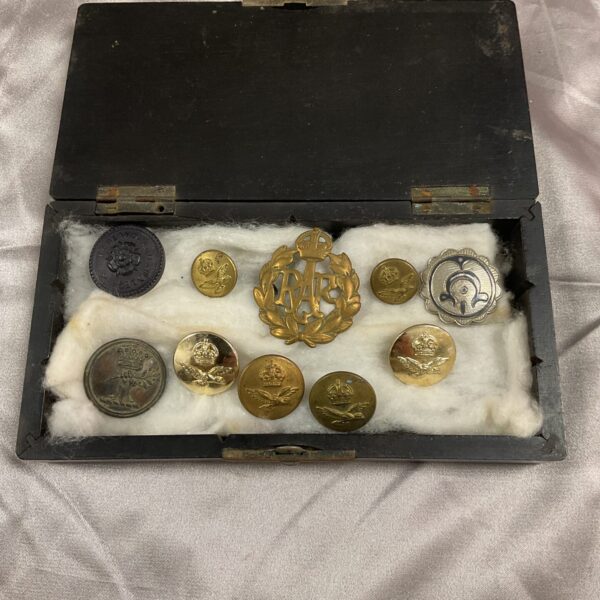 Vintage RAF badge and buttons from a WWII military memorabilia lot.