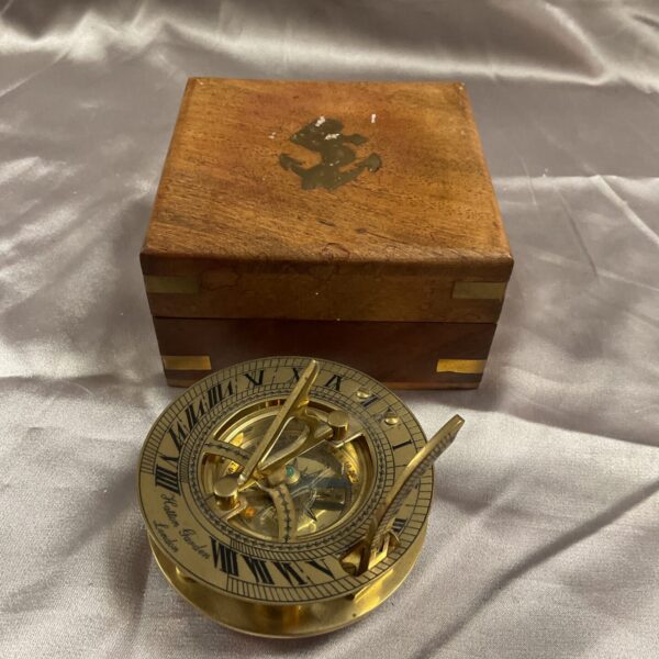 Antique Hatton Garden sundial compass in a wooden box.