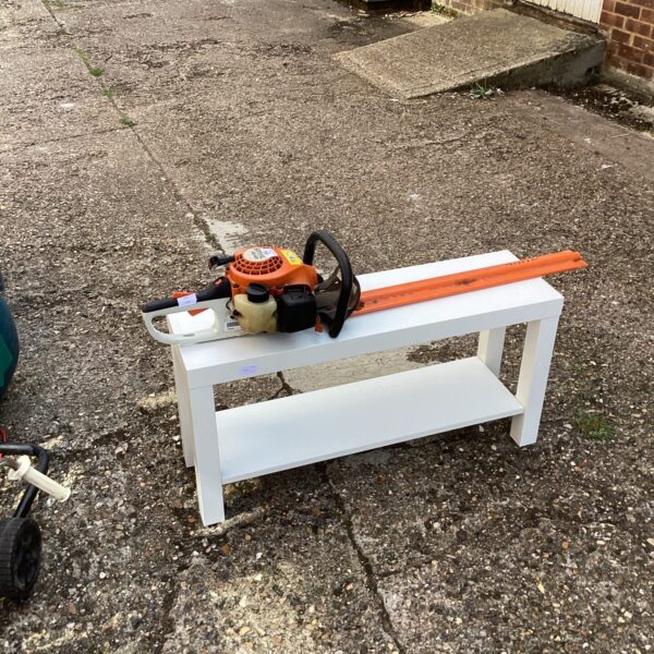 Used Stihl HS45 petrol hedge cutter for garden maintenance.