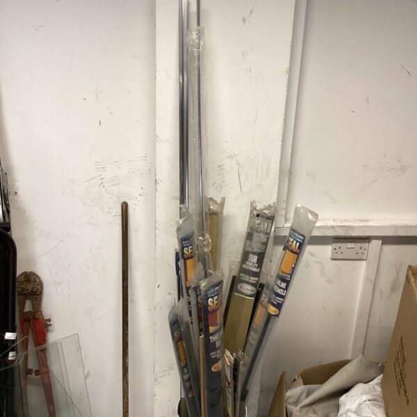Lot of metal carpet door threshold strips for flooring transitions.
