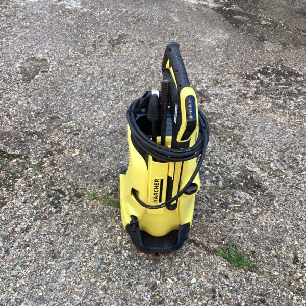 Front view of a used Karcher power washer for garden cleaning.