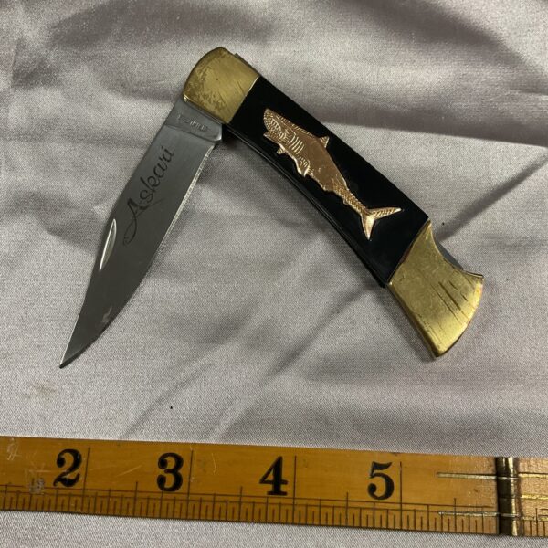 Vintage Askari shark pocket knife with sculpted handle.