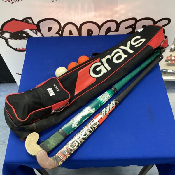 Hockey sticks and bag lot including Grays and Slazenger brands.