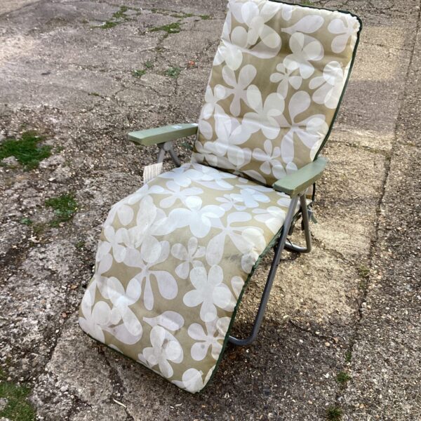 Vintage floral reclining garden chair for outdoor use.