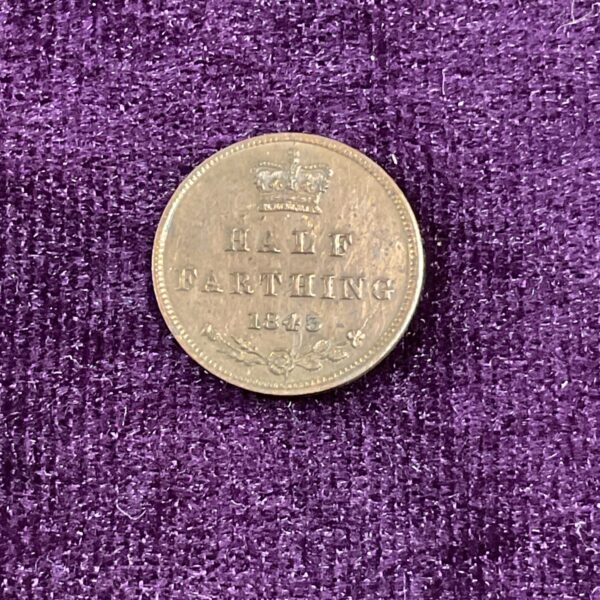 1843 half fathing coin obverse with Queen Victoria portrait.