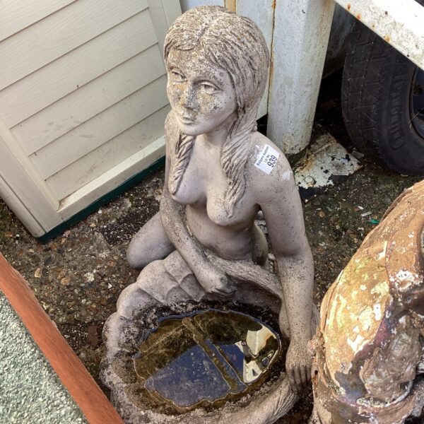 Vintage mermaid bird bath statue for garden decoration.