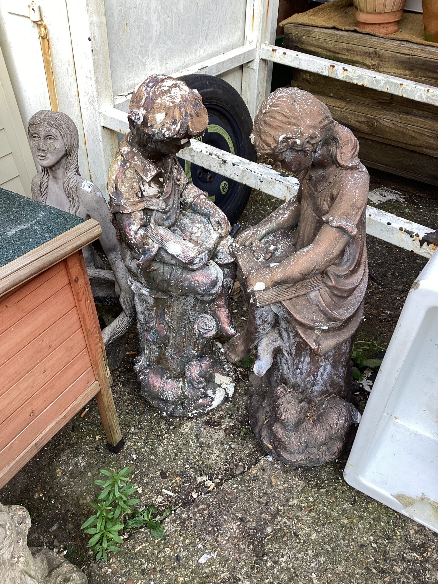 938 Boy and girl reading garden figures