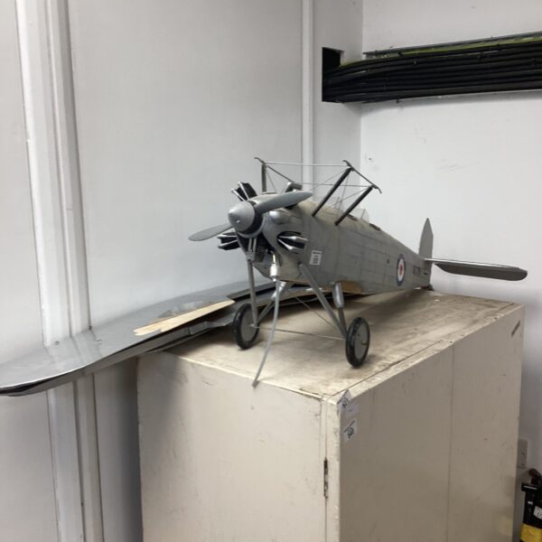 Vintage model biplane, a collectible aviation display piece.