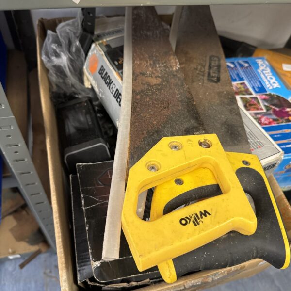 Vintage hand saw with wooden handle, ideal for woodworking and garden tasks.