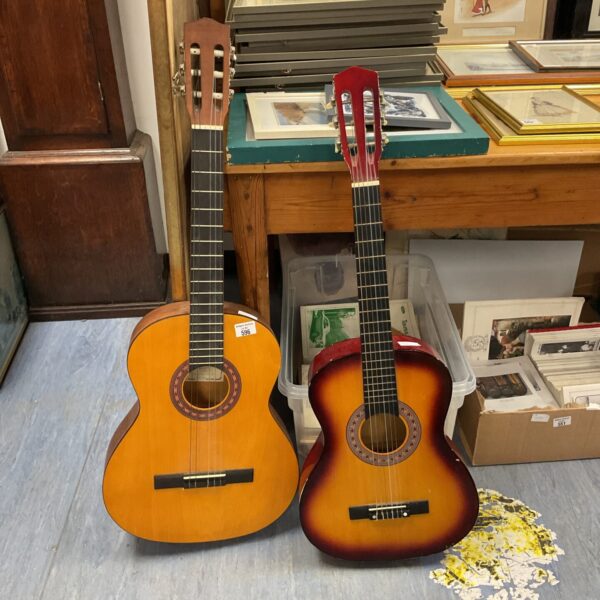 Pair of vintage acoustic guitars, one Encore, for sale.
